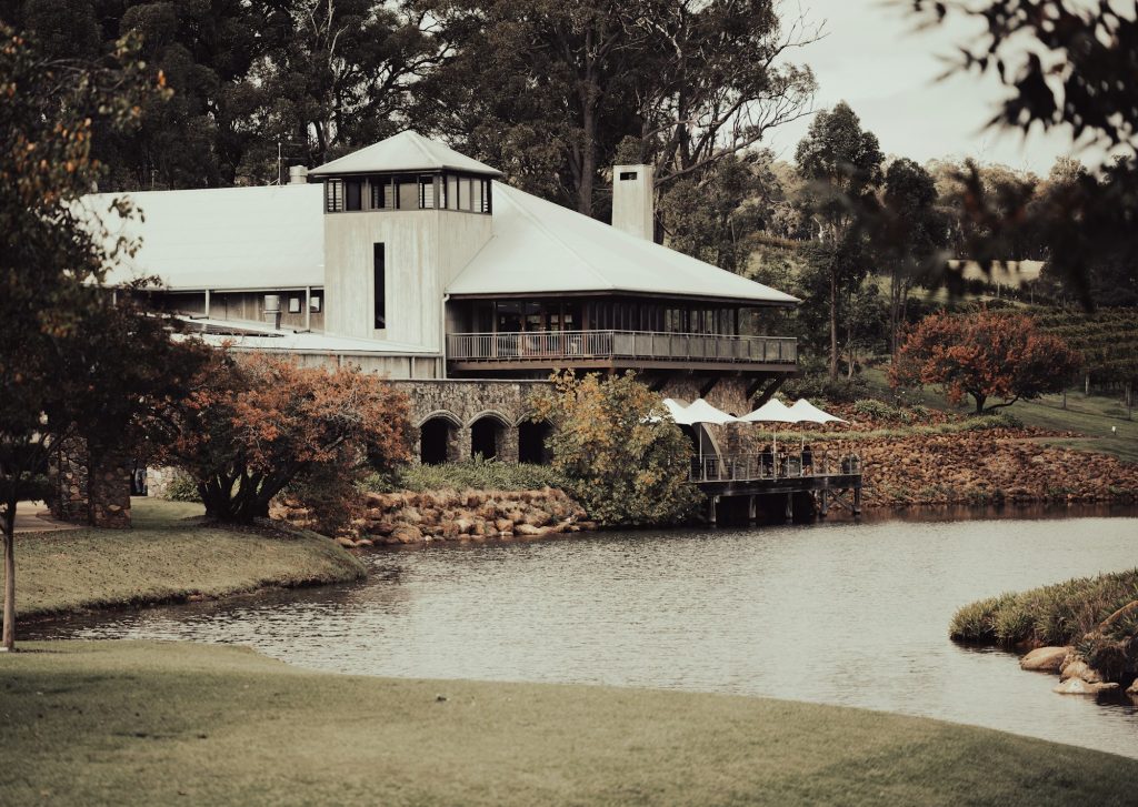 Heritage building with a jetty on a calm lake