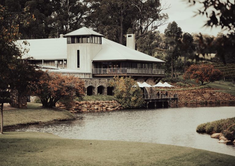 Heritage building with a jetty on a calm lake