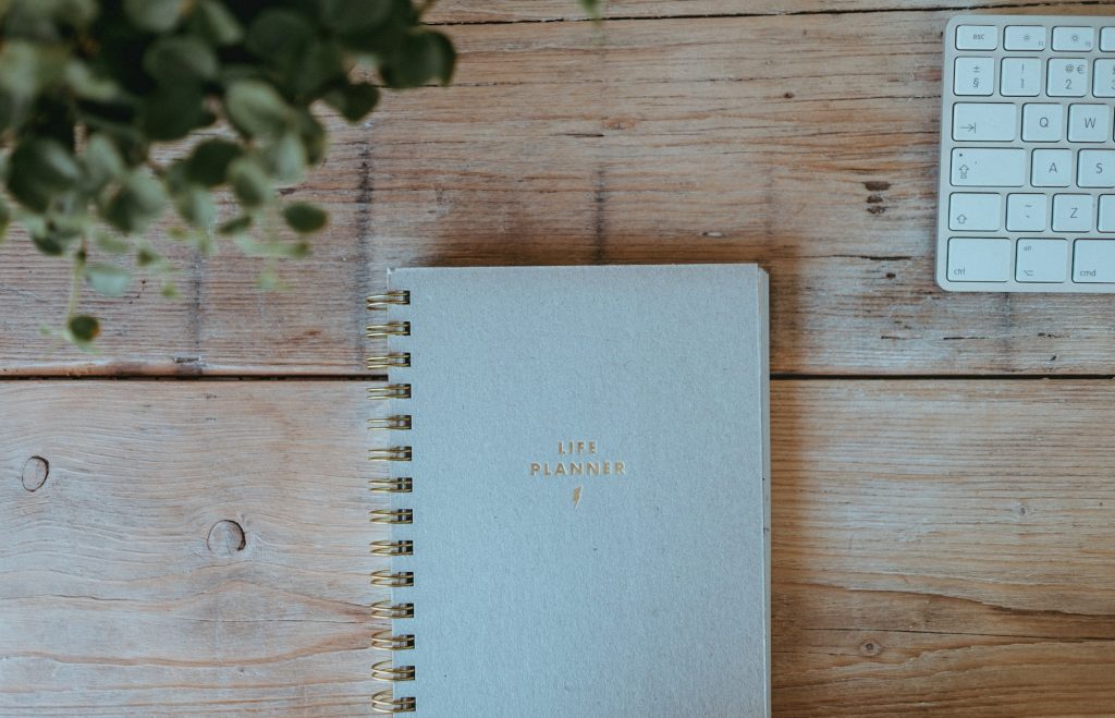 Wedding planning notebook on a timber table