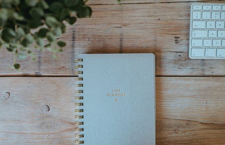 Wedding planning notebook on a timber table